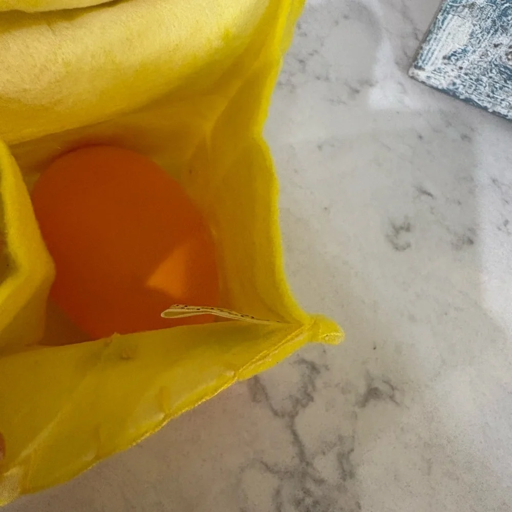 Kids Yellow Bunny Sunglasses and 2 felt bags each with a plastic egg